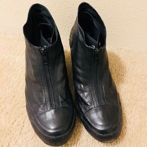 Black leather, wedge Chuck Taylor’s